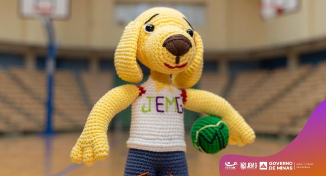 O mascote, um Golden Retriever chamado Mineirim, foi criado a partir do desenho da estudante-atleta Júlia Dias Machado, da Escola Estadual Doutor Adiron Gonçalves Boaventura, em Rio Paranaíba, no Alto Paranaíba. (Foto/Divulgação)